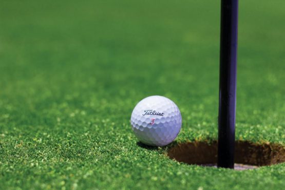 Golf balls on a tee